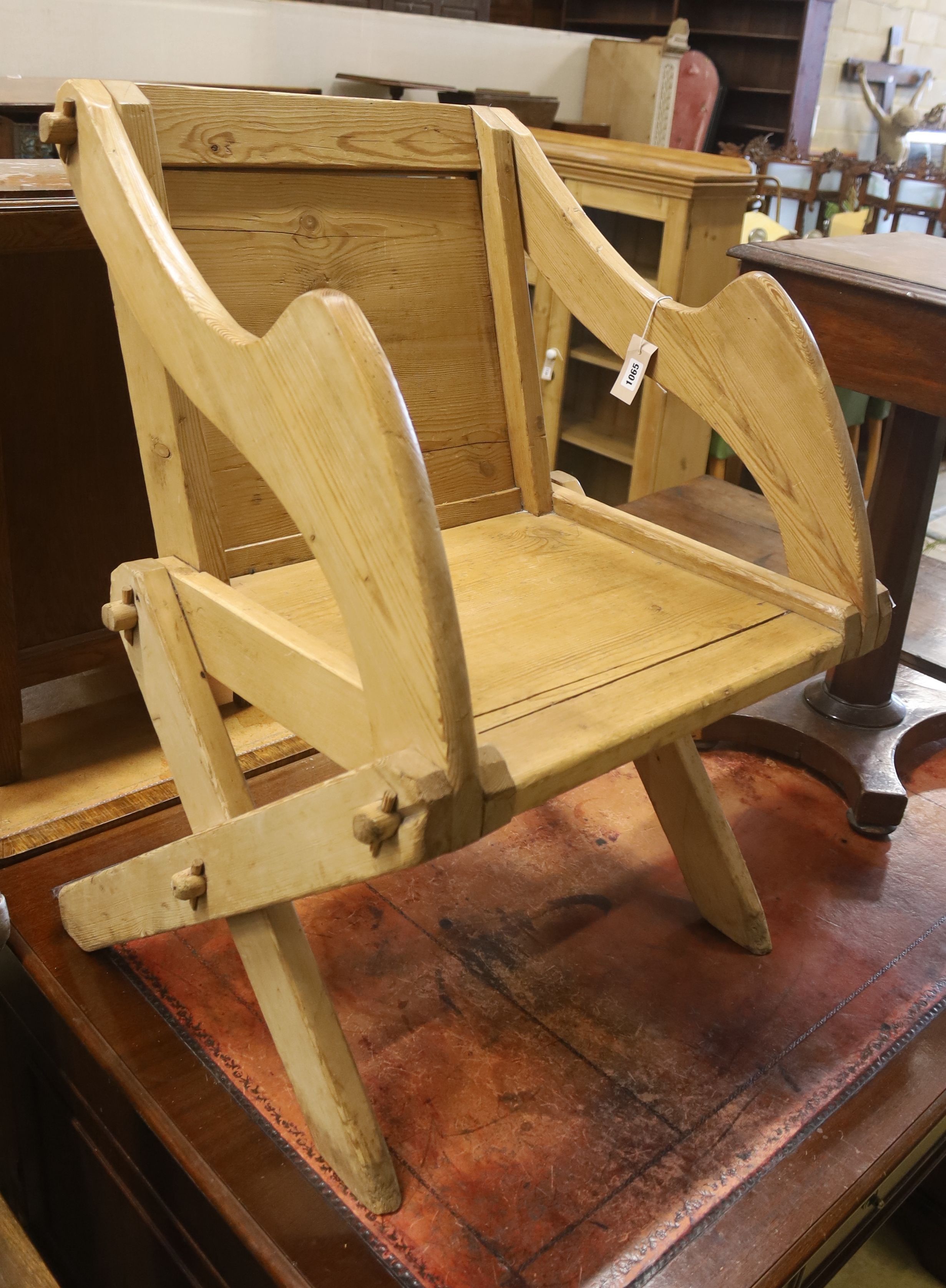 A Victorian pine Glastonbury type chair, width 69cm, depth 54cm, height 88cm